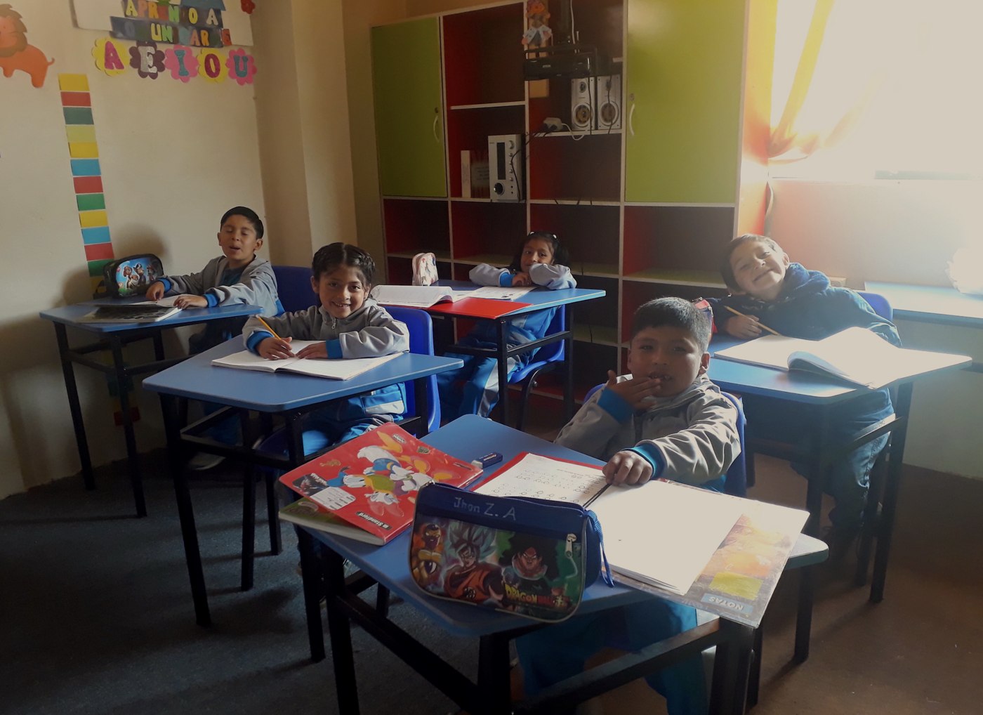 Students doing schoolwork in a classroom in Cusco, Peru